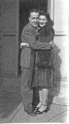 Vincent and Jennie Melone hugging in a doorway